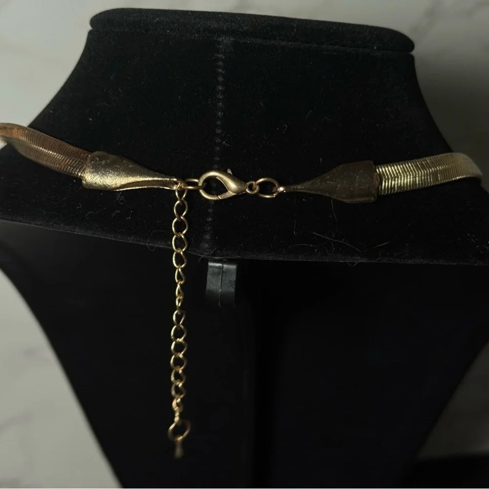 Elegant Gold Necklace with Textured Pendants